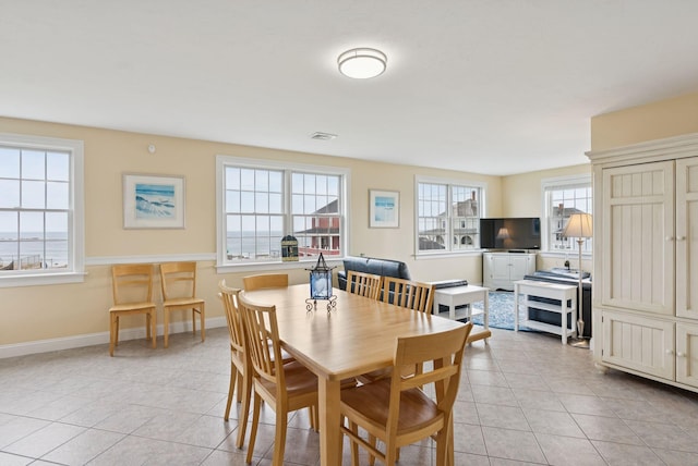 42 Rachel Carson Ln, Wells, ME 04090 - dining area with light tile patterned floors and baseboards