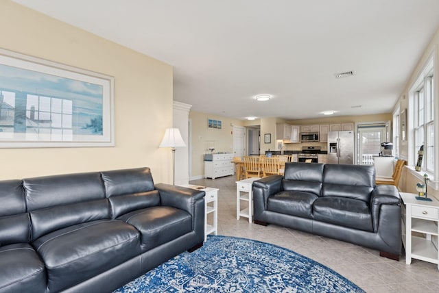 42 Rachel Carson Ln, Wells, ME 04090 - living room featuring light tile patterned floors and baseboards