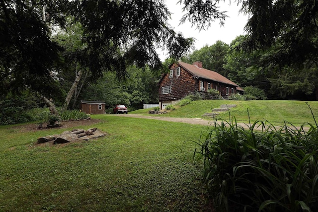 32 Williams Rd, Chelsea, ME 04330 - view of grassy yard with a storage shed