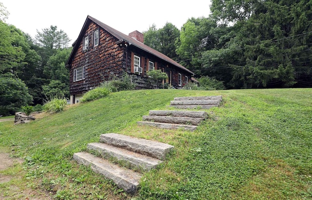 32 Williams Rd, Chelsea, ME 04330 - view of side of home featuring a chimney and a yard