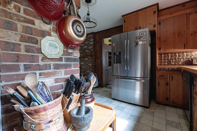 32 Williams Rd, Chelsea, ME 04330 - kitchen featuring stainless steel refrigerator with ice dispenser, brick wall, brown cabinetry, light floors, and dishwasher