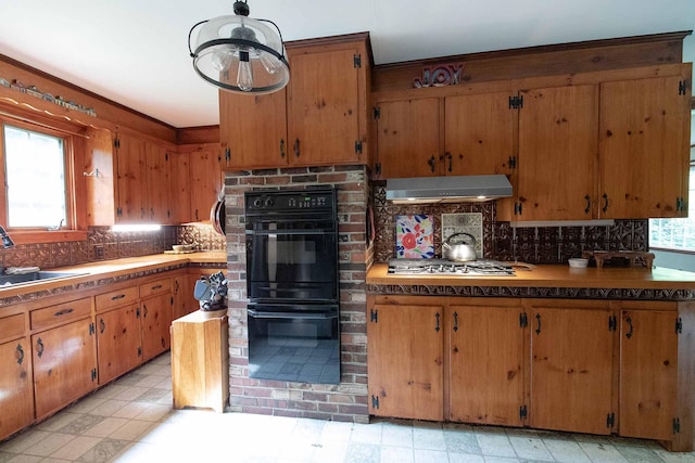 32 Williams Rd, Chelsea, ME 04330 - kitchen featuring under cabinet range hood, healthy amount of natural light, stainless steel gas cooktop, and decorative backsplash