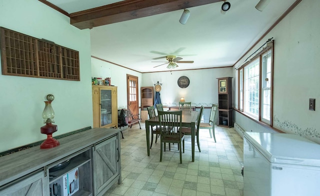 32 Williams Rd, Chelsea, ME 04330 - dining room featuring light flooring, a ceiling fan, a baseboard radiator, and crown molding