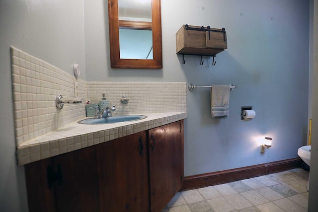 32 Williams Rd, Chelsea, ME 04330 - bathroom with vanity and backsplash