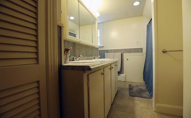 32 Williams Rd, Chelsea, ME 04330 - bathroom featuring double vanity, a wainscoted wall, and recessed lighting