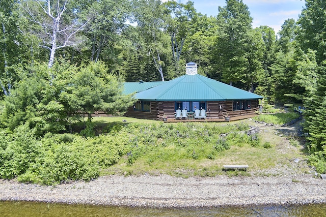 1 Zella Is Unit T14 R8, Wels, ME 04768 - view of side of property with log siding, a chimney, and a metal roof