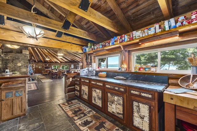 1 Zella Is Unit T14 R8, Wels, ME 04768 - kitchen featuring wooden ceiling, dark countertops, and dark stone finish floors