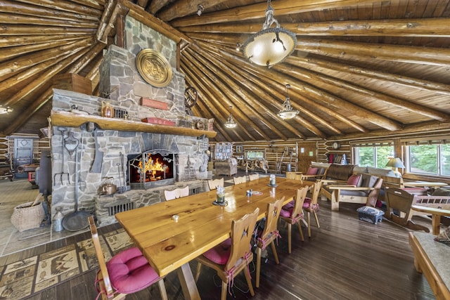 1 Zella Is Unit T14 R8, Wels, ME 04768 - dining area featuring hardwood / wood-style flooring, a wood ceiling with exposed beams, rustic walls, a fireplace, and high vaulted ceiling