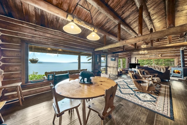 1 Zella Is Unit T14 R8, Wels, ME 04768 - dining space with a wood stove, a wood ceiling with exposed beams, hardwood / wood-style floors, and log walls