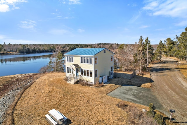 74 Spindle Rd, Ellsworth, ME 04605 - view of subject property featuring a nearby body of water and a heavily wooded area