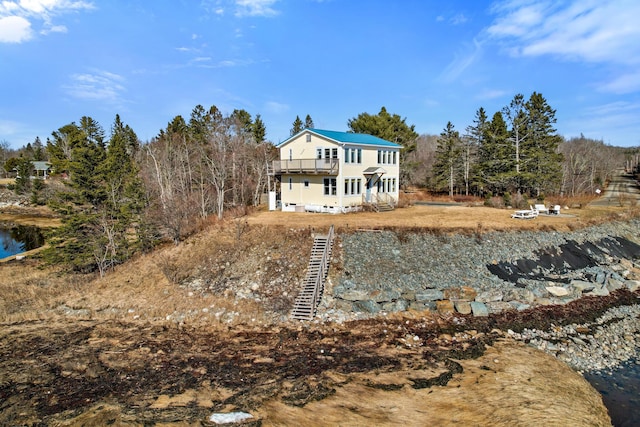 74 Spindle Rd, Ellsworth, ME 04605 - rear view of house with stairs and a balcony