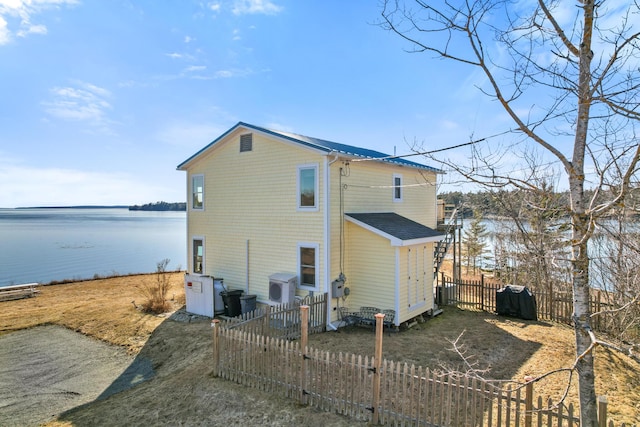 74 Spindle Rd, Ellsworth, ME 04605 - rear view of property featuring a water view and a fenced backyard