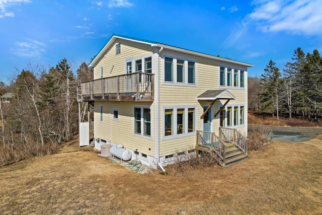 74 Spindle Rd, Ellsworth, ME 04605 - back of property with a balcony and a yard