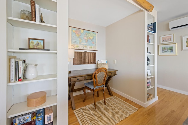 74 Spindle Rd, Ellsworth, ME 04605 - office area with wood finished floors and an AC wall unit
