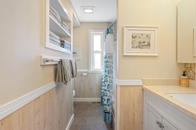 74 Spindle Rd, Ellsworth, ME 04605 - bathroom with wainscoting, vanity, curtained shower, and wooden walls