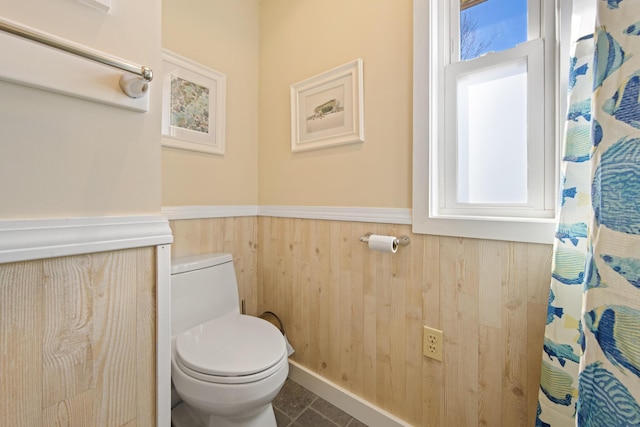 74 Spindle Rd, Ellsworth, ME 04605 - bathroom featuring wainscoting, wood walls, tile patterned floors, and a shower with curtain