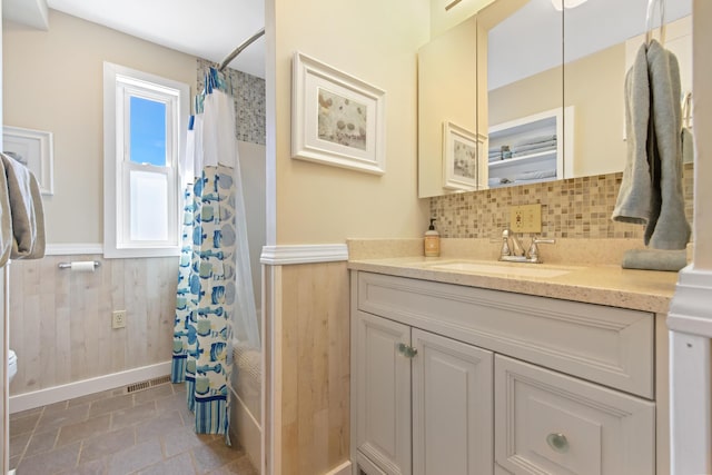74 Spindle Rd, Ellsworth, ME 04605 - bathroom featuring vanity, a wainscoted wall, decorative backsplash, and wooden walls
