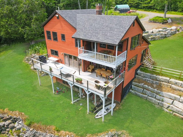 93 Hopkins Rd, Hampden, ME 04444 - rear view of property with roof with shingles, a chimney, a deck, stairway, and a lawn