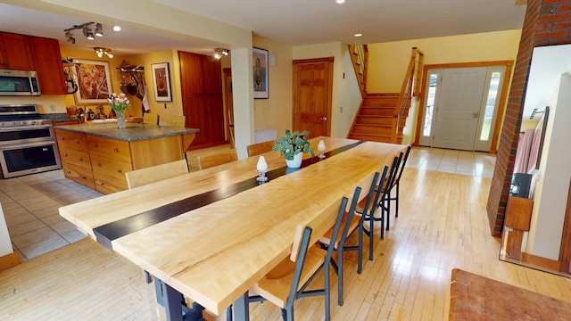 93 Hopkins Rd, Hampden, ME 04444 - dining room with light wood-type flooring, stairway, recessed lighting, and rail lighting
