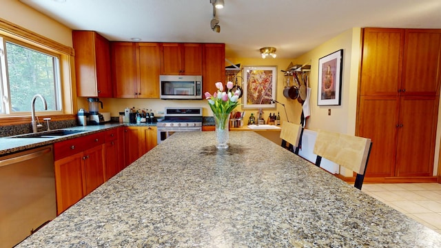 93 Hopkins Rd, Hampden, ME 04444 - kitchen featuring appliances with stainless steel finishes, light stone counters, and light tile patterned floors