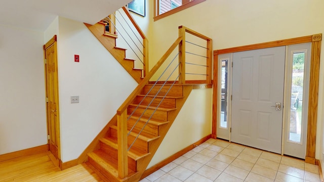 93 Hopkins Rd, Hampden, ME 04444 - entryway featuring stairway and baseboards