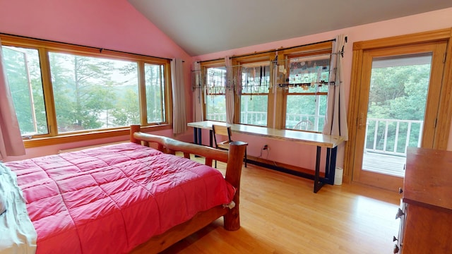 93 Hopkins Rd, Hampden, ME 04444 - bedroom with lofted ceiling, light wood-style flooring, and access to outside