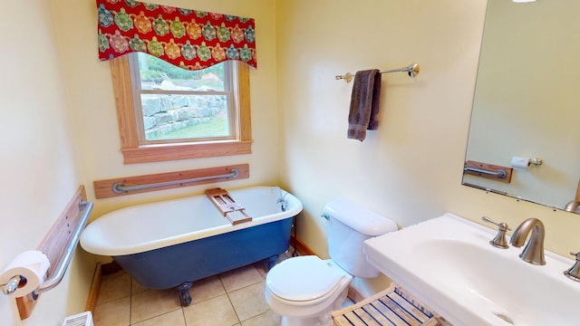 93 Hopkins Rd, Hampden, ME 04444 - bathroom featuring a freestanding tub and tile patterned flooring