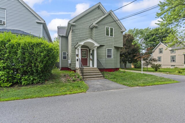 13 Newman St, Lewiston, ME 04240 - view of front of home featuring a front lawn