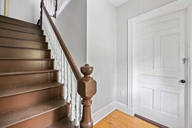 13 Newman St, Lewiston, ME 04240 - stairs featuring wood finished floors and baseboards