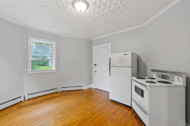 13 Newman St, Lewiston, ME 04240 - kitchen with white appliances, an ornate ceiling, light wood finished floors, ornamental molding, and baseboard heating