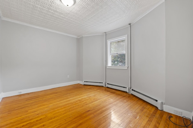 13 Newman St, Lewiston, ME 04240 - unfurnished room featuring crown molding, light wood-style floors, and an ornate ceiling