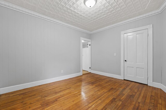 13 Newman St, Lewiston, ME 04240 - spare room featuring an ornate ceiling, hardwood / wood-style floors, and crown molding