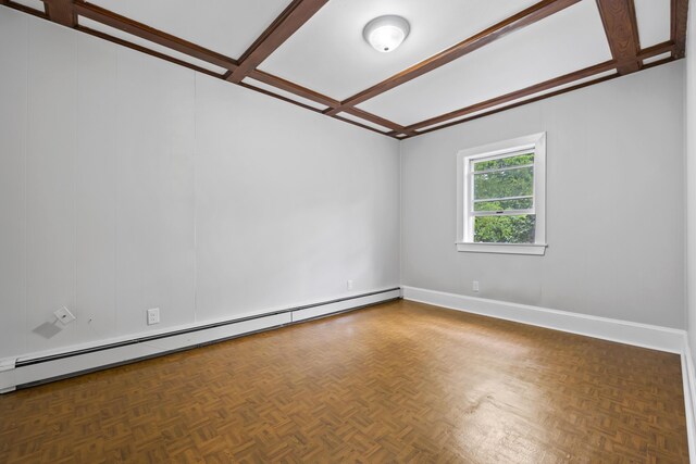 13 Newman St, Lewiston, ME 04240 - empty room with a baseboard heating unit, coffered ceiling, and beam ceiling