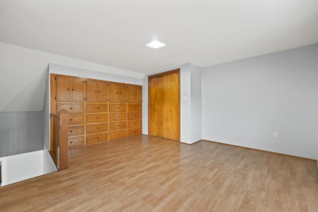 13 Newman St, Lewiston, ME 04240 - unfurnished bedroom with light wood finished floors and a closet