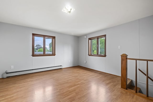 13 Newman St, Lewiston, ME 04240 - empty room featuring a baseboard radiator and light wood finished floors
