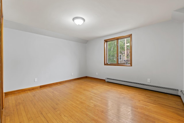 13 Newman St, Lewiston, ME 04240 - unfurnished room featuring light wood finished floors, lofted ceiling, and baseboard heating