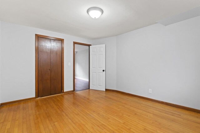 13 Newman St, Lewiston, ME 04240 - unfurnished bedroom featuring a closet and light wood-type flooring