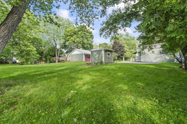 13 Newman St, Lewiston, ME 04240 - view of green lawn with a storage unit