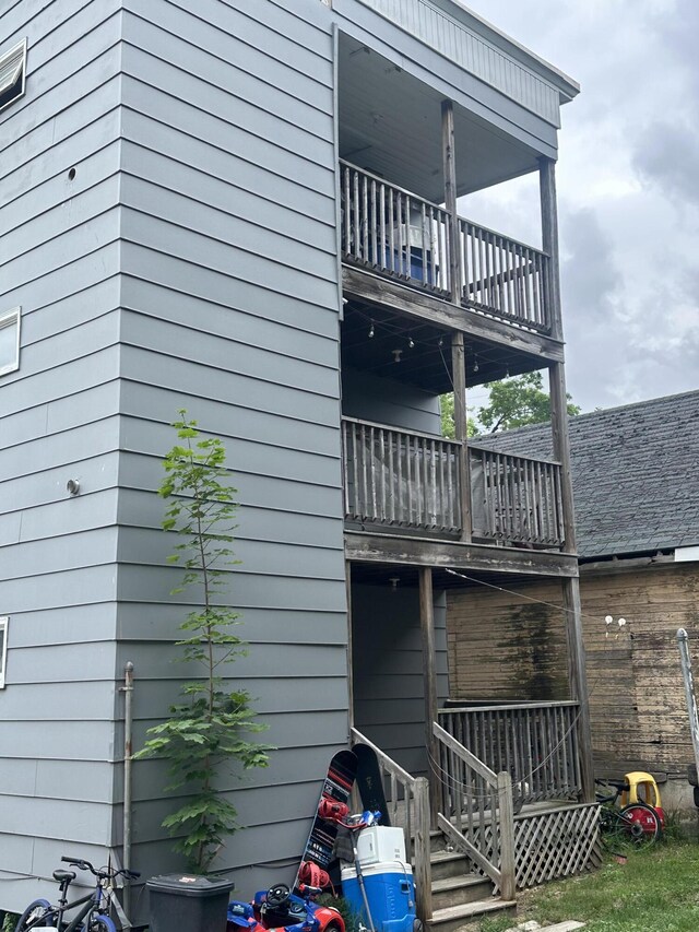 95 Wood St, Lewiston, ME 04240 - view of side of home with a balcony