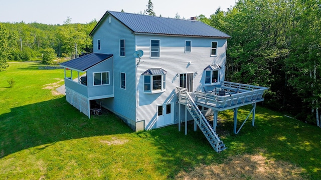 119 Merritt Rd, Steuben, ME 04680 - rear view of property with a metal roof, a lawn, a deck, stairs, and a view of trees