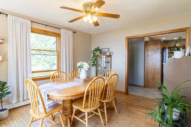 119 Merritt Rd, Steuben, ME 04680 - dining area featuring light wood-style flooring and a ceiling fan