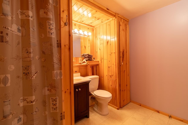 119 Merritt Rd, Steuben, ME 04680 - full bath with vanity, tile patterned floors, curtained shower, and wood walls