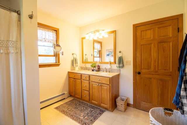 119 Merritt Rd, Steuben, ME 04680 - bathroom with a baseboard radiator, double vanity, and a chandelier