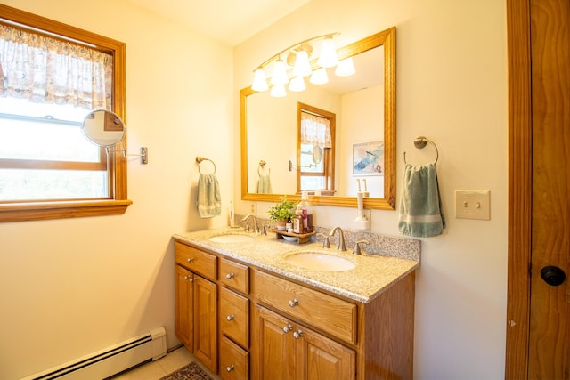 119 Merritt Rd, Steuben, ME 04680 - full bathroom featuring a baseboard radiator, double vanity, and tile patterned flooring