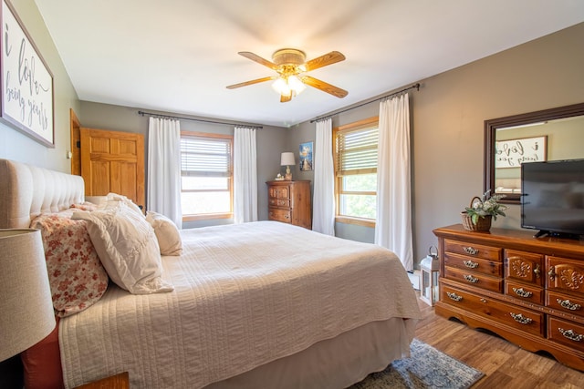 119 Merritt Rd, Steuben, ME 04680 - bedroom with wood finished floors and ceiling fan