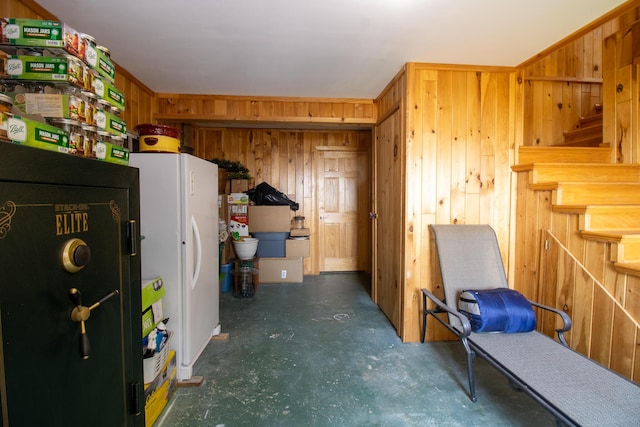 119 Merritt Rd, Steuben, ME 04680 - living area featuring wood walls, concrete floors, and stairs