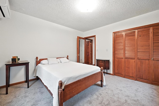 3 Tallwood Rd, Augusta, ME 04330 - bedroom with a wall unit AC, light carpet, a textured ceiling, and a closet