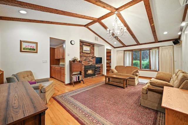 3 Tallwood Rd, Augusta, ME 04330 - living room with a fireplace, light wood finished floors, a chandelier, and recessed lighting