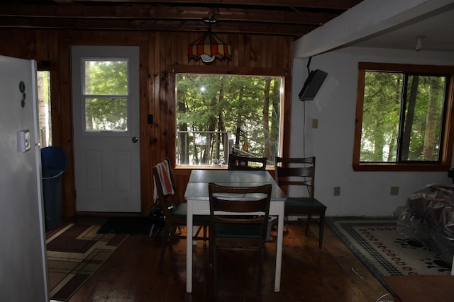8 Drake Ln, Oakfield, ME 04763 - dining space with wood-type flooring, plenty of natural light, wooden walls, and beam ceiling