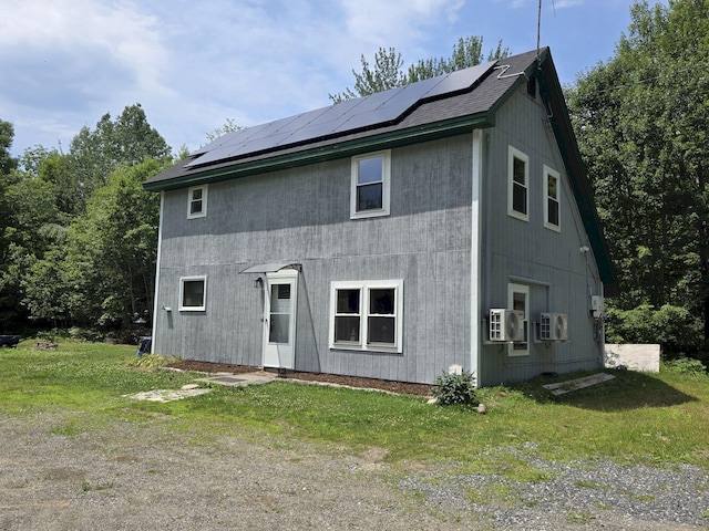 340 Campground Rd, Anson, ME 04958 - back of house with solar panels and a lawn